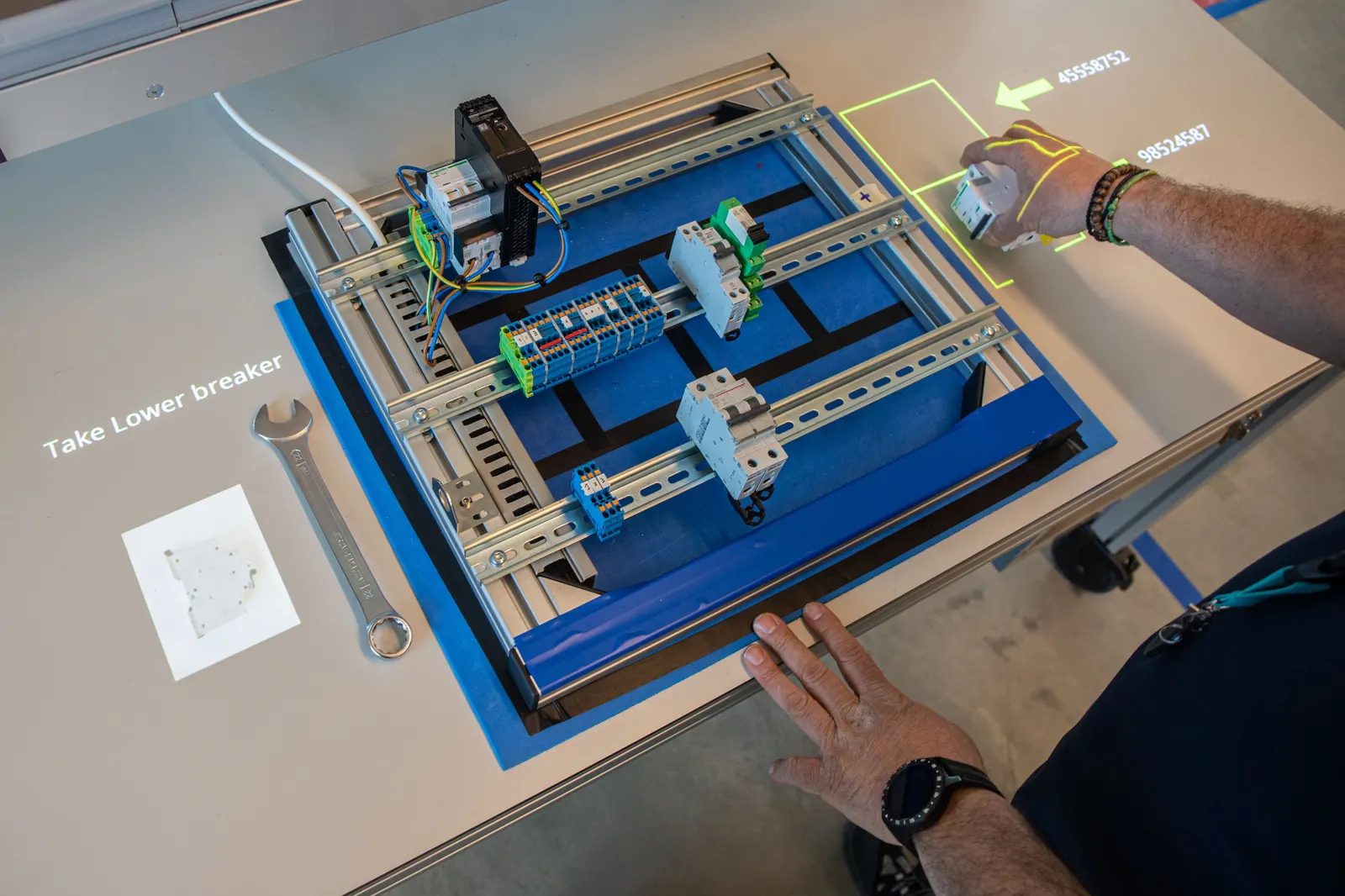 Step-by-step instructions and the target position projected directly onto a cable board assembly