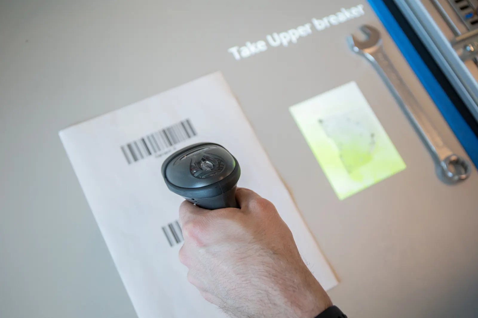 Operator scans a barcode to load the right job and variant