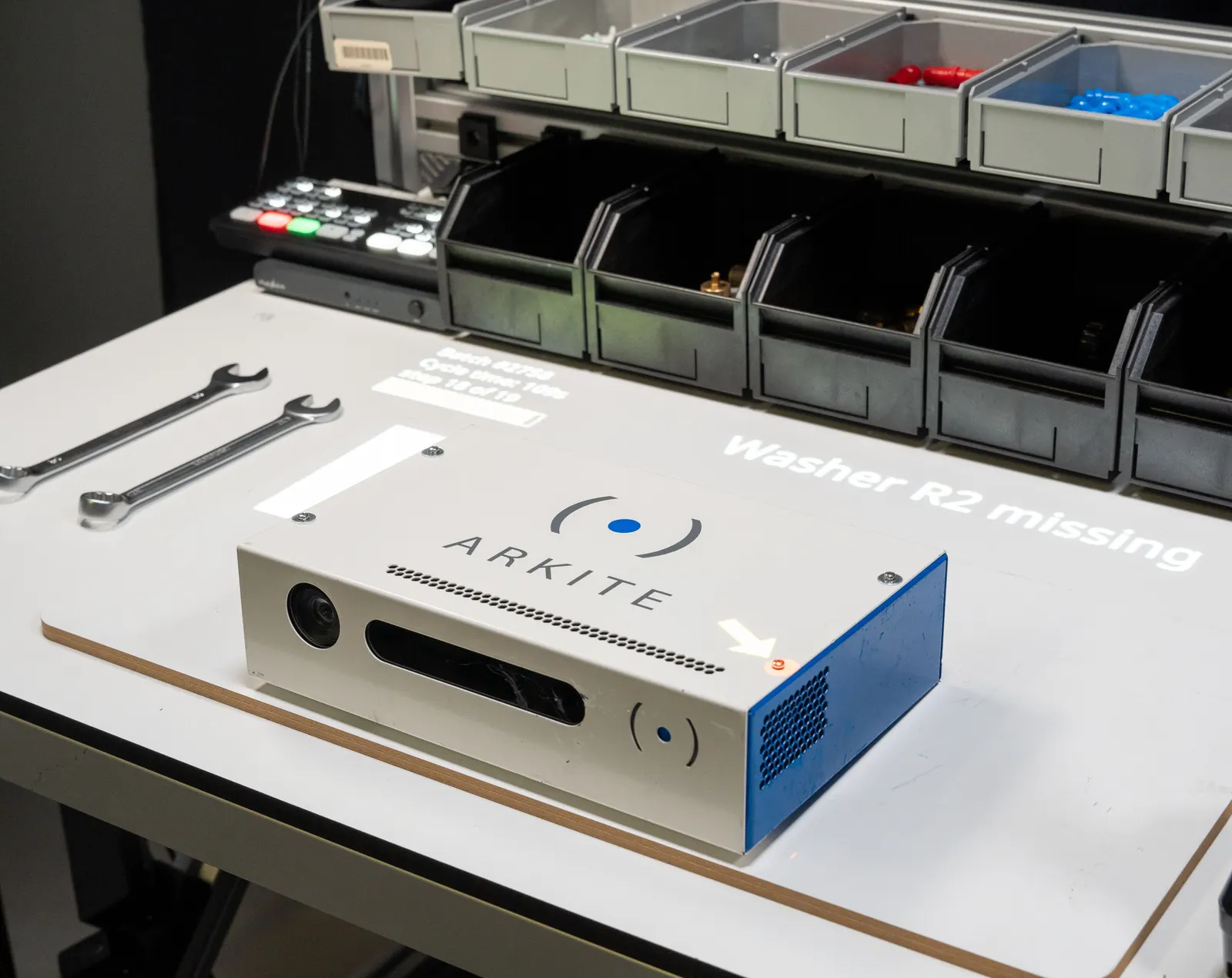 The vision sensor detects a missing washer and the projection tells the operator: Washer R2 missing