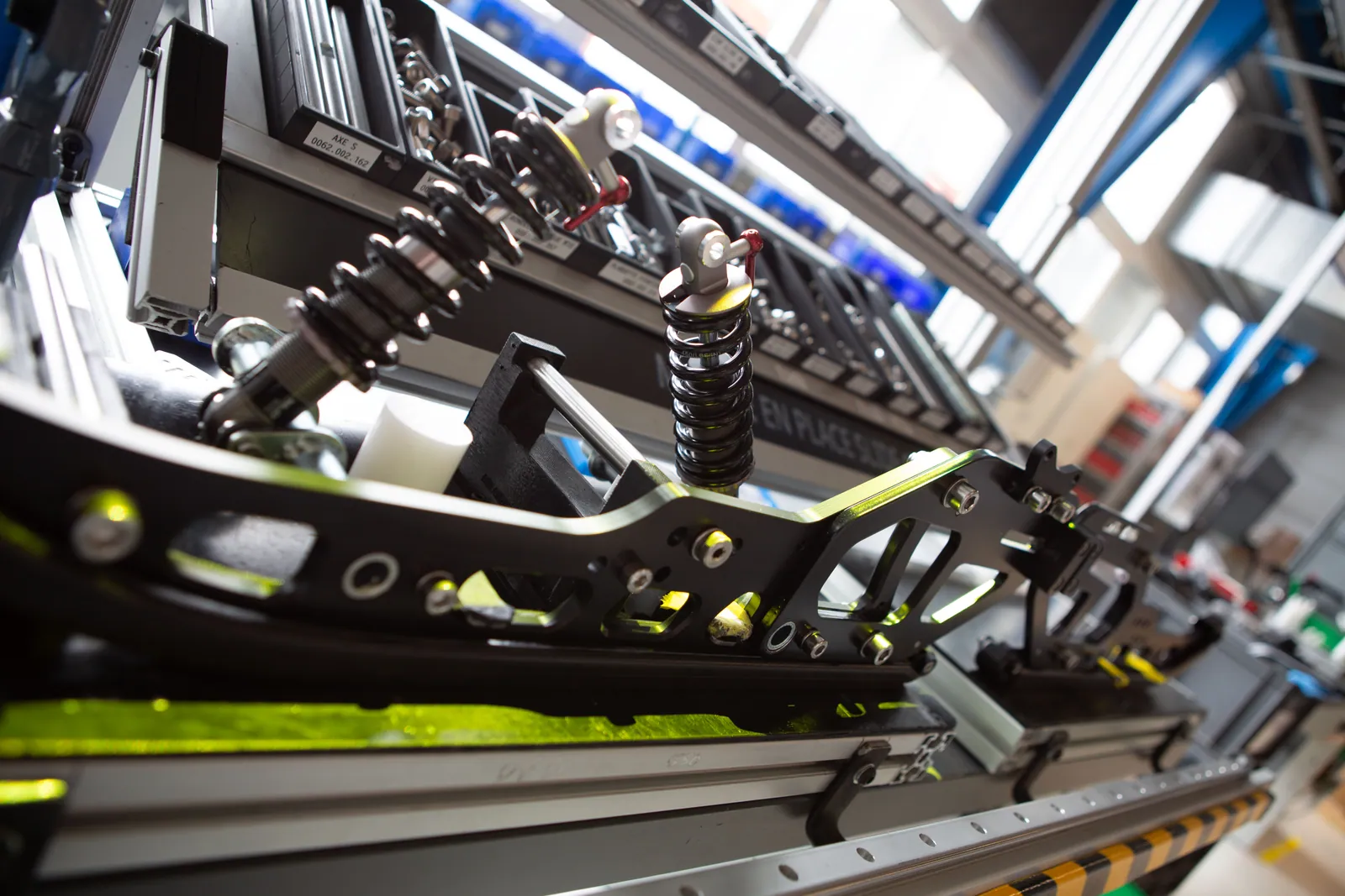 Assembly workstation with projected guidance highlighting the next component position